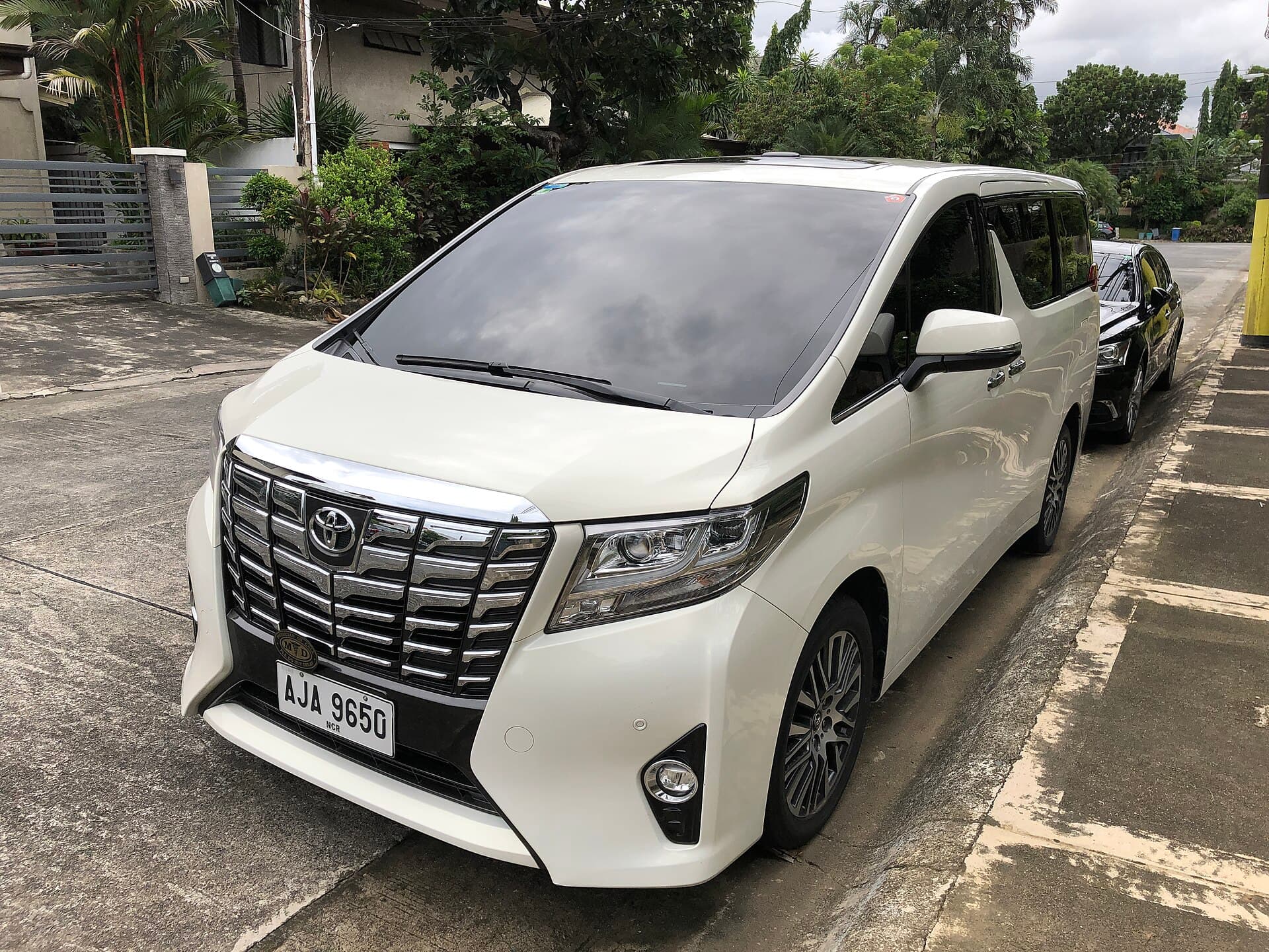 White Toyota Alphard used for local transfers